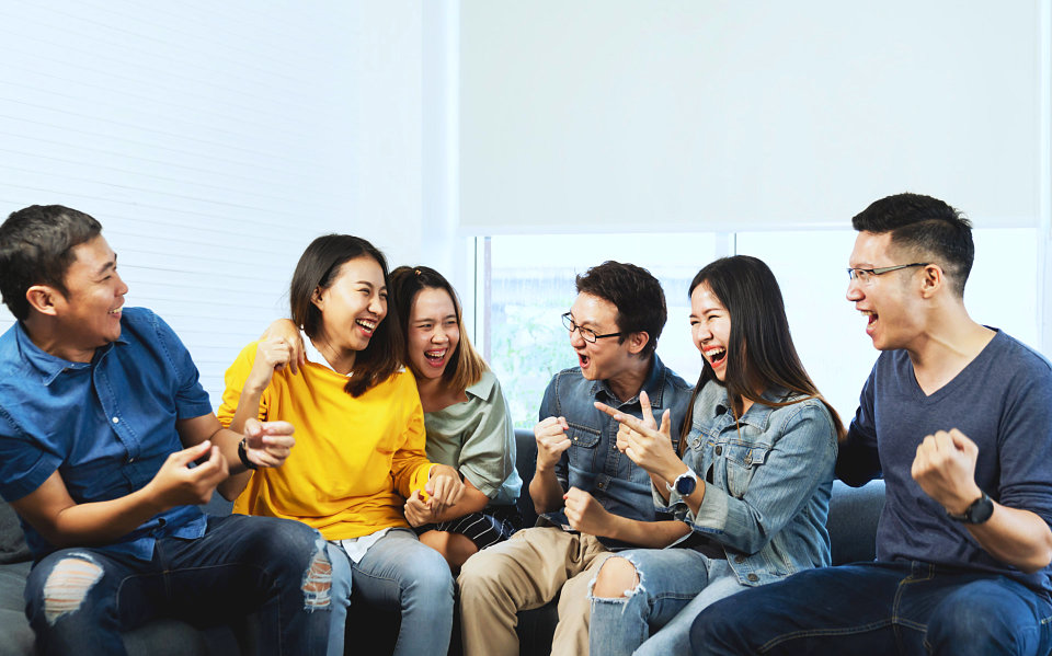 group of people are laughing