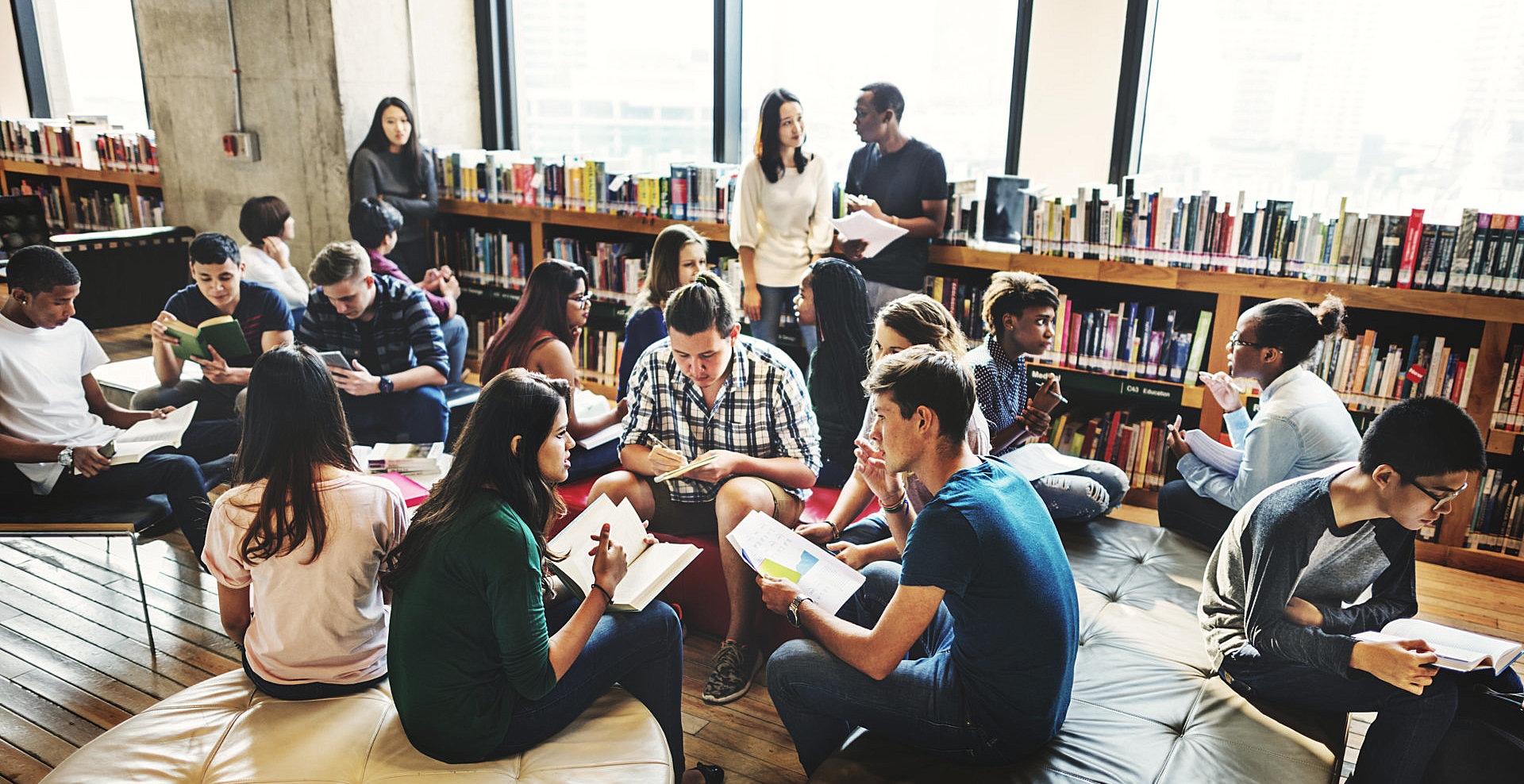 group of student are studying at the library